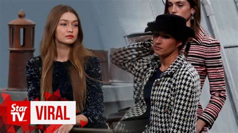 Gigi Hadid stops Chanel fashion show crasher, comedian Marie 